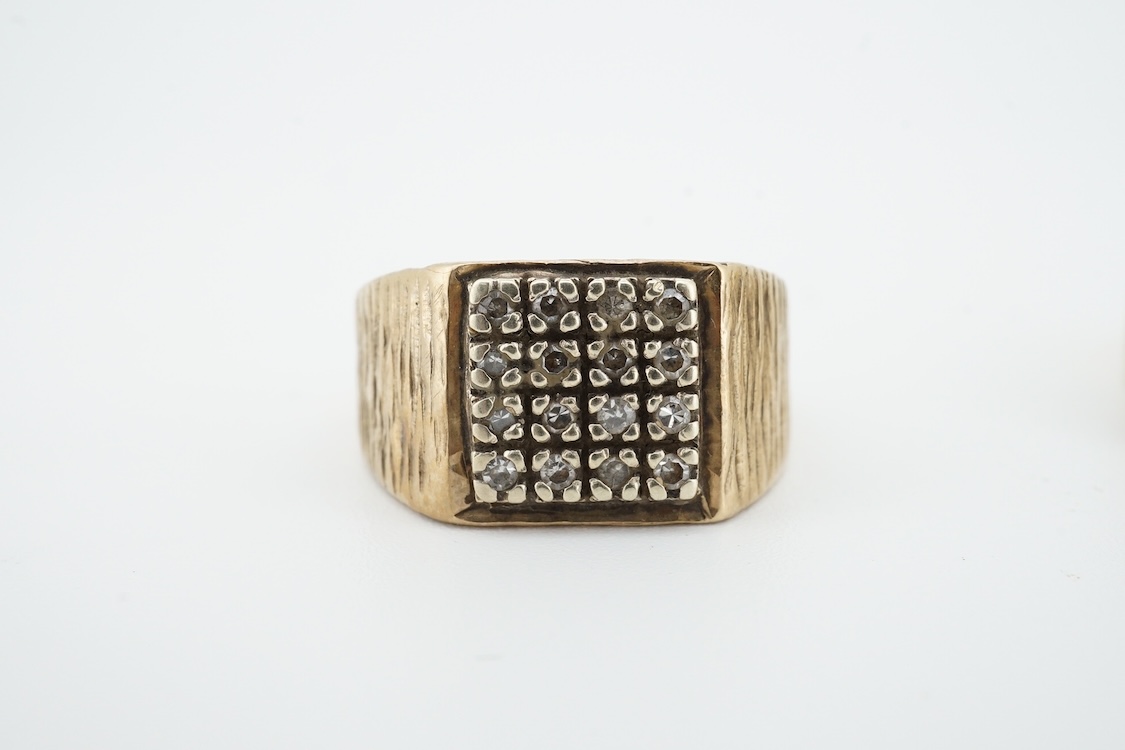 A 10k and two stone diamond set ring, size R/S, together with a damaged 9k and diamond cluster set signet ring, gross weight 13.5 grams.